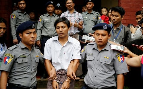 Kyaw Soe Oo was also arrested for his investigation into military atrocities - Credit: Ann Wang/Reuters