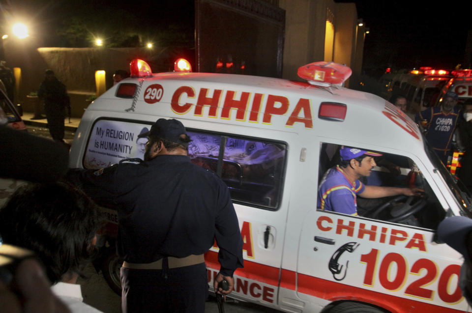 An ambulance transports an injured from the site of bomb blast in Quetta, Pakistan, Wednesday, April 21, 2021. A powerful bomb went off in the parking area of a five-star Serena hotel in the southwestern city of Quetta on Wednesday, wounding some people, police said. (AP Photo/Arshad Butt)