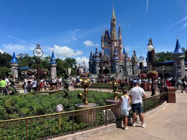 FILE PHOTO: People gather at the Walt Disney World Magic Kingdom theme park in Orlando