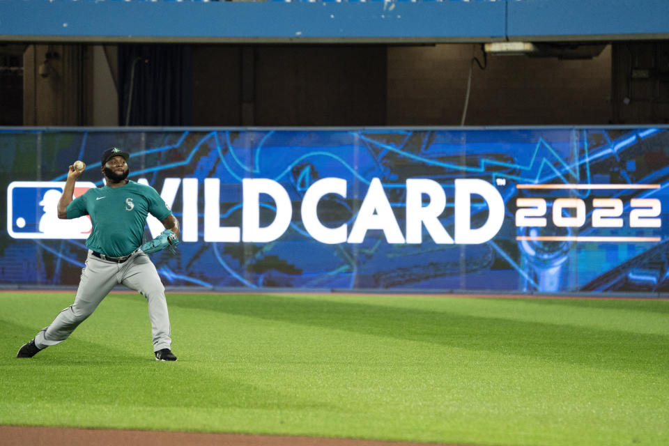 Seattle Mariners pitcher Diego Castillo (63) throws in the outfield during a baseball workout, Thursday, Oct. 6, 2022, in Toronto ahead of the team's wildcard playoff game against the Toronto Blue Jays. (Alex Lupul/The Canadian Press via AP)