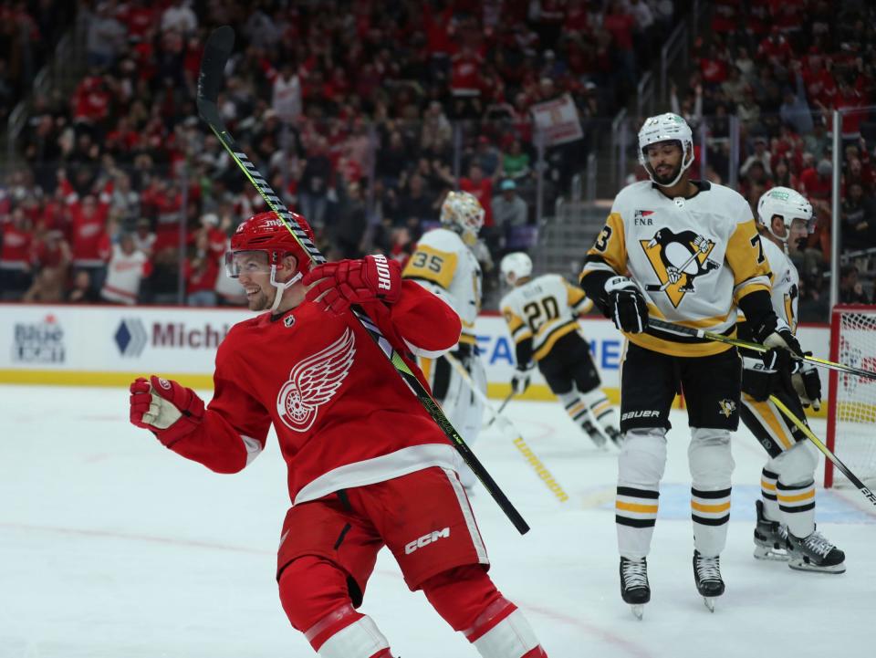 Red Wings center Austin Czarnik celebrates a goal against the Penguins during the first period of the Wings' 6-3 win on Wednesday, Oct. 18 2023, at Little Caesars Arena.