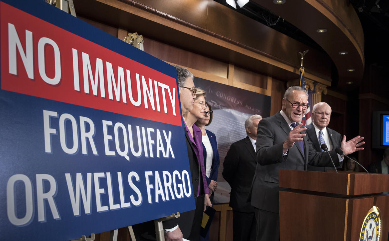 Senate Minority Leader Chuck Schumer, D-N.Y. and other Senate Democrats, from left, Sen. Al Franken, D-Minn., Sen. Elizabeth Warren, D-Mass., Sen. Catherine Cortez Masto, D-Nev., Sen. Jack Reed, D-R.I., and Sen. Patrick Leahy, D-Vt., discuss consumer protections in the wake of a massive data breach at Equifax and a scandal at Wells Fargo, at the Capitol in Washington, Wednesday, Sept. 27, 2017. Executives for both Wells Fargo and Equifax will testify in Senate committees next week. (AP Photo/J. Scott Applewhite)