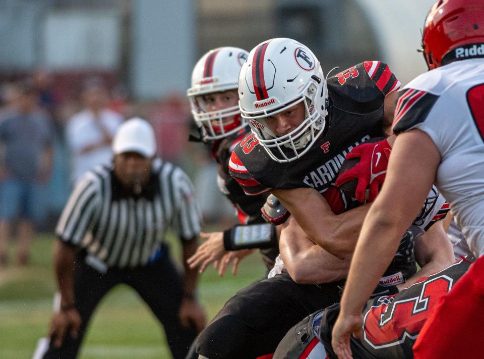 Forreston's Owen Mulder makes a short gain in the first quarter of their game against Fulton in Forreston on Friday, Aug. 25, 2023.