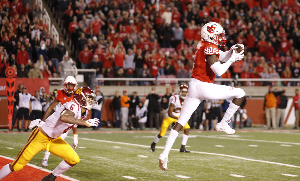 Utah defensive back Jaylon Johnson (1) catches a interception in front of Southern California wide receiver Michael Pittman Jr. (6) in the second half during an NCAA college football game against Southern California Saturday, Oct. 20, 2018, in Salt Lake City. (AP Photo/Rick Bowmer)