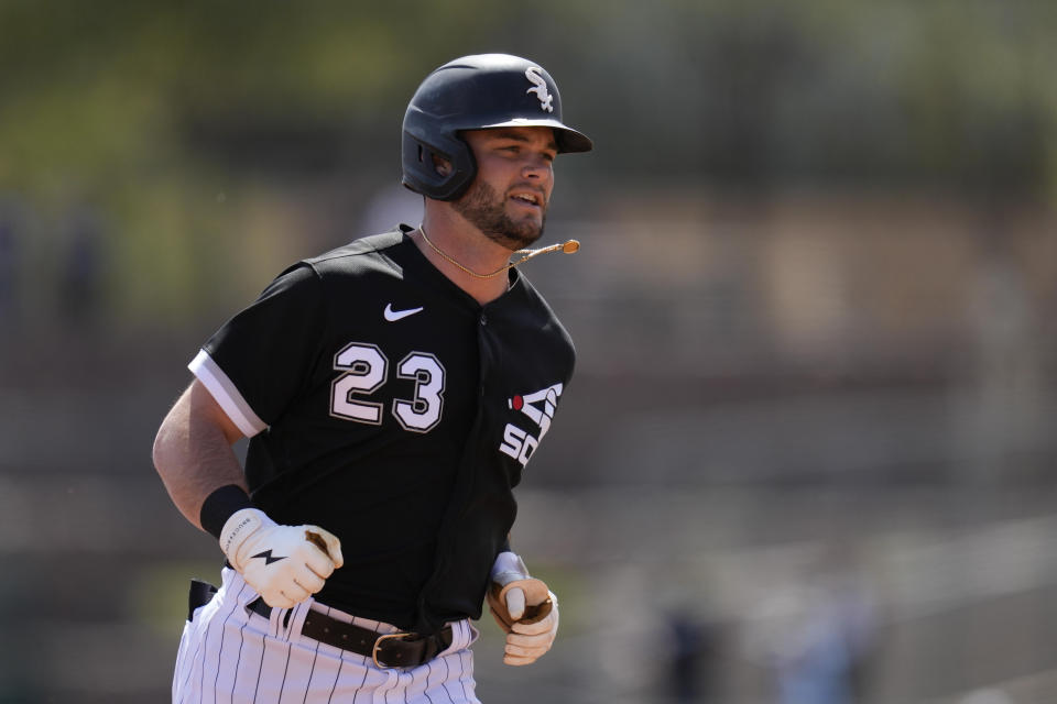 Chicago White Sox's Andrew Benintendi (23) runs the bases after hitting a home run during the first inning of a spring training baseball game against the Los Angeles Dodgers in Glendale, Ariz., Saturday, March 18, 2023. (AP Photo/Ashley Landis)