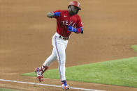 Texas Rangers' Adolis Garcia runs the bases after hitting a solo home run during the seventh inning of a baseball game against the Minnesota Twins in Arlington, Texas, Friday, June 18, 2021. (AP Photo/Andy Jacobsohn)