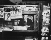 <p>A publication at a newsstand in America announces the German surrender.</p>