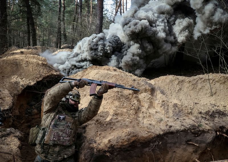 FILE PHOTO: A Ukrainian serviceman of the National Guard takes part in radiation, chemical and biological hazard drills near Kharkiv