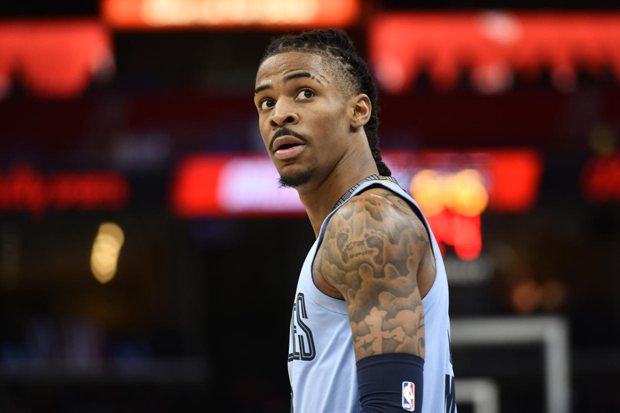 Memphis Grizzlies guard Ja Morant (12) plays in the first half of an NBA basketball game against the Utah Jazz Wednesday, Feb. 15, 2023, in Memphis, Tenn. (AP Photo/Brandon Dill)