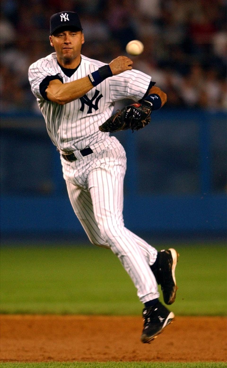 Yankees shorstop Derek Jeter throws out the Angels' David Eckstein at first during the fourth inning in Game 2 of the American League Division Series on Wednesday, Oct. 2, 2002, at Yankee Stadium in New York.