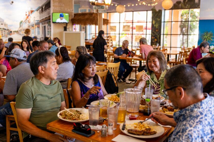 LOS ANGELES, CA - AUGUST 11, 2023: Diners fill up Back Home in Lahaina, a Hawaiian restaurant in Carson popular spot with local Hawaiians, as it hosts one of tehir regular live music events on Friday, Aug. 11, 2023 in Carson, CA. The restaurant encouraged its patrons to contribute to a fund for the victims of the devastating fire, one of three that swept through Maui, and near leveled the historic town of 12,000 Lahaina on Wednesday, Aug. 9, 2023, killing 80 people as counted by Saturday. (Silvia Razgova / For The Times)