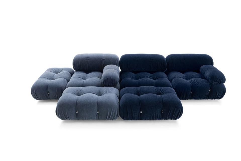 large blue sectional tufted sofa with ottomans