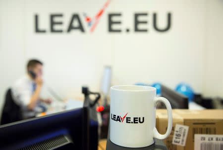 A worker answers a telephone in the office of Brexit group pressure group "Leave.eu" in London, Britain February 12, 2016. REUTERS/Neil Hall