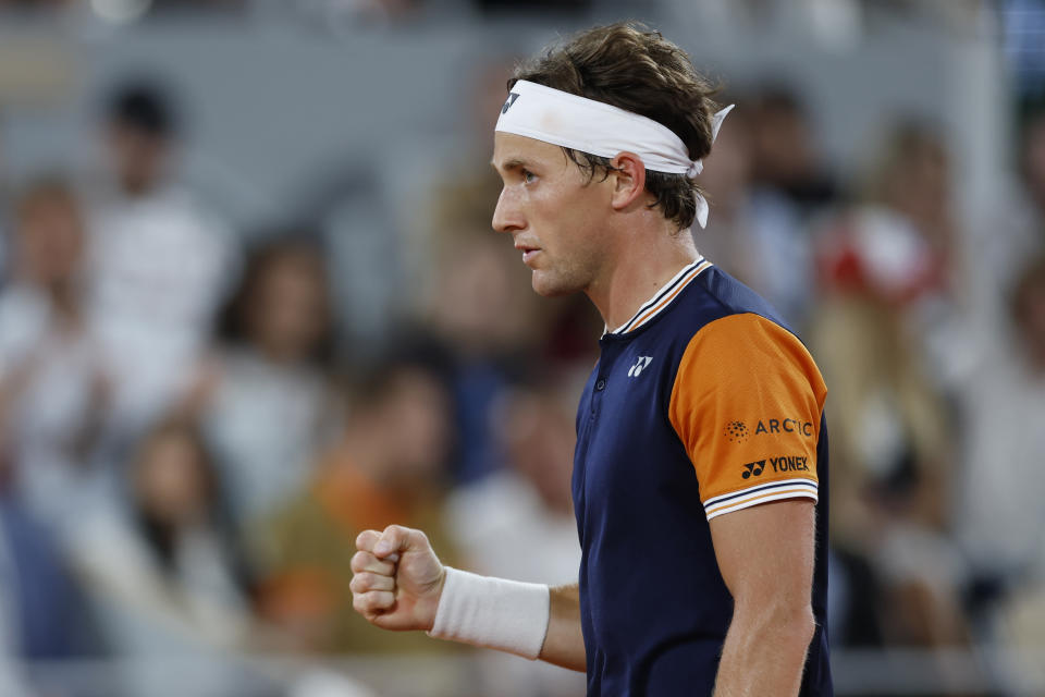 Norway's Casper Ruud clenches his fist after scoring a point against Denmark's Holger Rune during their quarterfinal match of the French Open tennis tournament at the Roland Garros stadium in Paris, Wednesday, June 7, 2023. (AP Photo/Jean-Francois Badias)