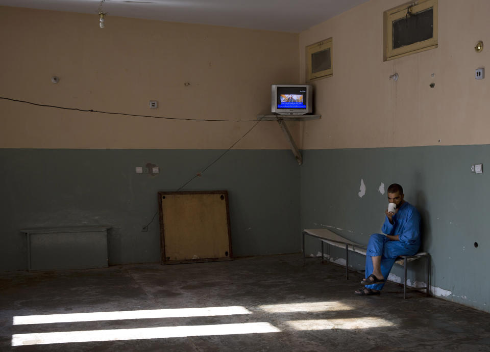 FILE - An Afghan drug addict sits alone in a dilapidated TV room at a drug treatment facility in the eastern Nangarhar provincial capital of Jalalabad on Nov. 12, 2013. Afghanistan is the world’s fastest-growing maker of methamphetamine, a report from the United Nations drug agency said Sunday, Sept. 10, 2023. The country is also a major opium producer and heroin source, even though the Taliban declared a war on narcotics after they returned to power in August 2021.(AP Photo/Anja Niedringhaus, File)