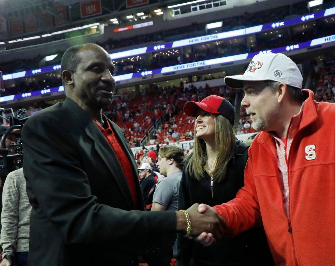 David Thompson greets fans following a halftime ceremony to honor members of the N.C. State men’s basketball 1974 national championship team on Saturday, Feb. 24, 2024, at PNC Arena in Raleigh, N.C.