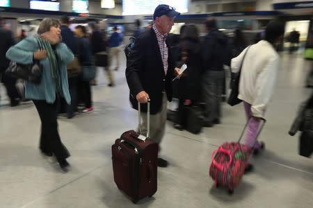 People walk though Pennsylvania Station in the Manhattan borough of New York City, New York, U.S. May 22, 2017. REUTERS/Carlo Allegri