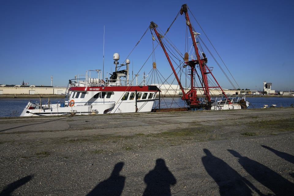 The British trawler kept by French authorities docks at the port in Le Havre, western France, Thursday, Oct. 28, 2021. French authorities fined two British fishing vessels and kept one in port overnight Thursday Oct.28, 2021 amid a worsening dispute over fishing licenses that has stoked tensions following the U.K.'s departure from the European Union. (AP Photo/Michel Euler)