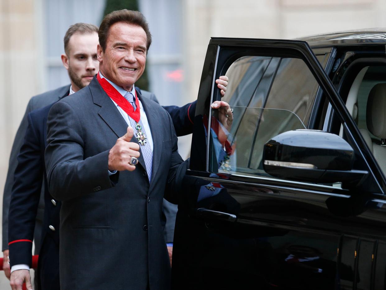 US actor and former governor of California Arnold Schwarzenegger gives the thumbs-up sign after he was awarded France's highest national order the 'Chevalier (Knight) de la Légion d'Honneur' by the president of France at the Elysee Palace in Paris, on April 28, 2017.