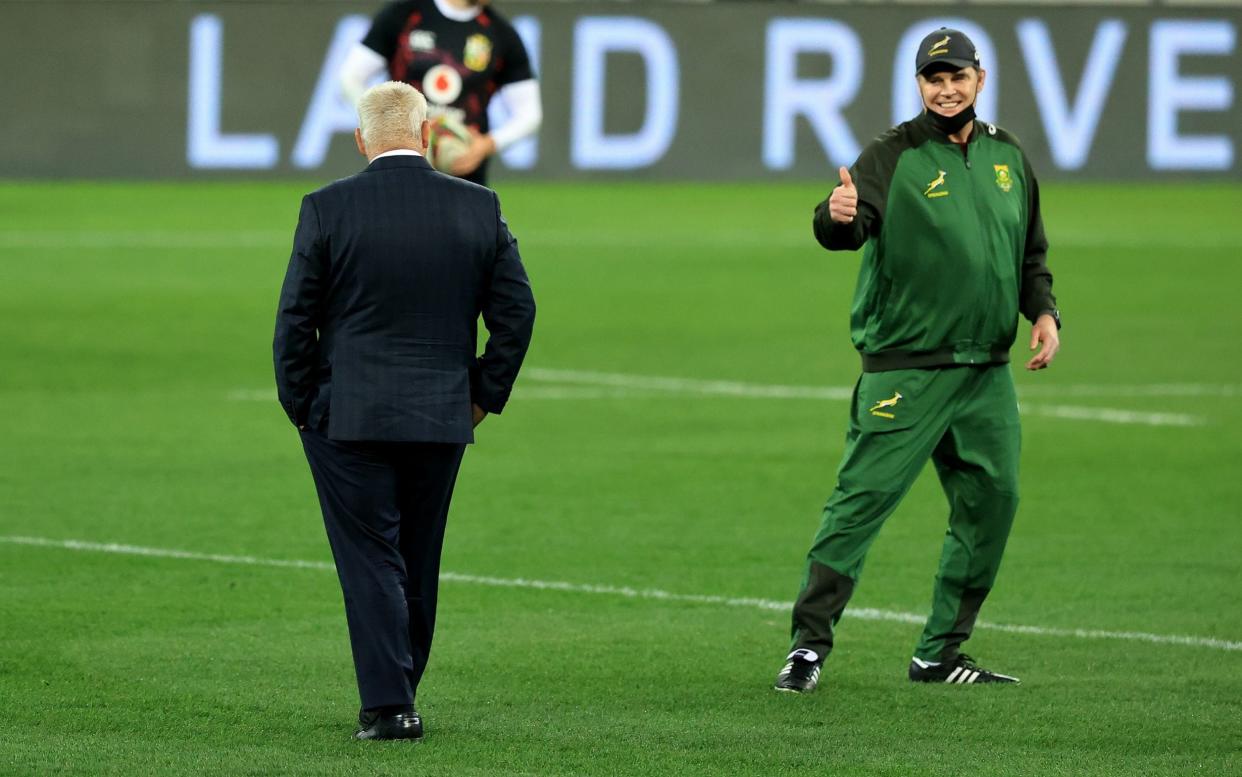 Rassie Erasmus, (R) the South Africa Springbok head coach,signals to the Lions head coach, Warren Gatland prior to the match between South Africa A and the British & Irish Lions at Cape Town Stadium on July 14, 2021 in Cape Town, South Africa. - GETTY IMAGES