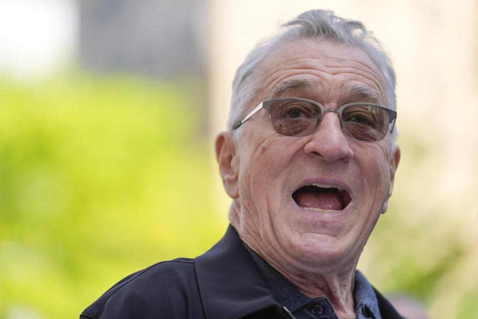 Robert De Niro speaks to reporters in support of President Joe Biden across the street from former President Donald Trump's criminal trial in New York, Tuesday, May 28, 2024. (AP Photo/Seth Wenig)