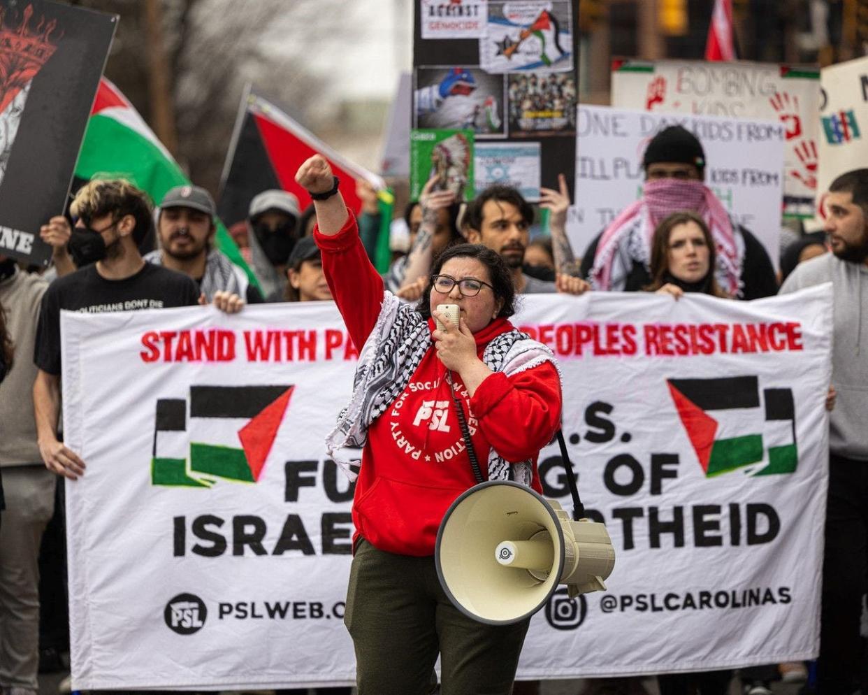 Dana Alhasan marches in a Charlotte protest to stand up for Palestine on March 9