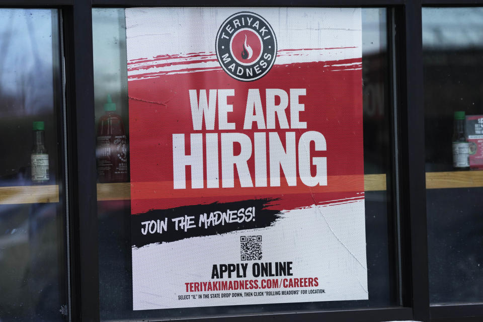 A hiring sign is displayed at a restaurant in Rolling Meadows, Ill., Monday, Jan. 30, 2023. America’s employers added a robust 517,000 jobs in January, a surprisingly strong gain in the face of the Federal Reserve’s aggressive drive to slow growth and tame inflation with higher interest rates.(AP Photo/Nam Y. Huh)