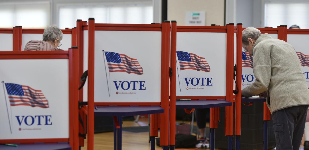 SOUTH YARMOUTH  05/16/23  Residents head to the patriotic voting booths at the Yarmouth Senior Center to cast their ballots in the town's annual elections. Steve Heaslip 