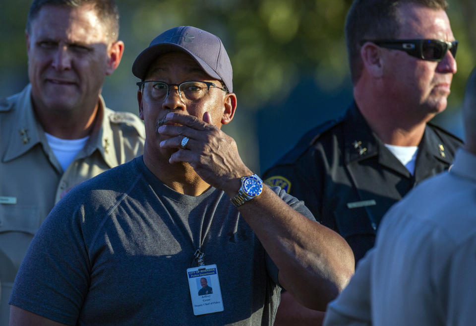 Riverside City Deputy Chief of Police Jeffrey Greer reacts at the scene where a shootout near a freeway killed a California Highway Patrol officer and wounded two others before the gunman was fatally shot, Monday, Aug. 12, 2019, in Riverside, Calif. (Terry Pierson/The Orange County Register via AP)