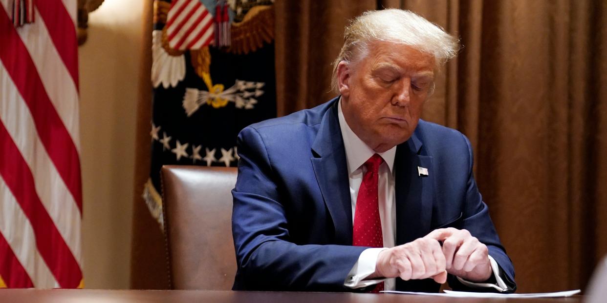 FILE - In this July 9, 2020, file photo President Donald Trump listens during a meeting with Hispanic leaders in the Cabinet Room, Thursday, July 9, 2020, in Washington. Republicans are trying to convince voters that the rare looting and violence that marred largely peaceful social justice protests foretell a wave of mayhem to come if Democrats are elected in November. Trump emphasized that menacing theme at the White House on Thursday, calling proponents of defunding the police “crazy.” Noting to a visiting group of Hispanic Americans that many immigrants had fled dangerous countries, Trump added, “They know what happens when the police cannot protect the innocent, when the rule of law is destroyed.” (AP Photo/Evan Vucci, File)