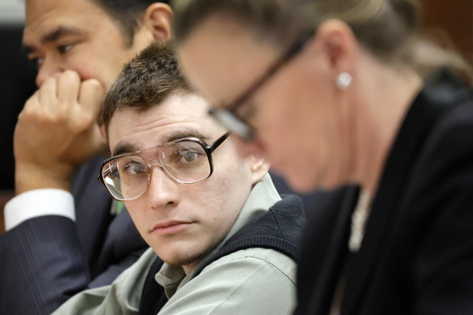 Marjory Stoneman Douglas High School shooter Nikolas Cruz is shown at the defense table during jury selection in the penalty phase of his trial at the Broward County Courthouse in Fort Lauderdale on Tuesday, June 28, 2022. Cruz previously plead guilty to all 17 counts of premeditated murder and 17 counts of attempted murder in the 2018 shootings. (Amy Beth Bennett/South Florida Sun Sentinel via AP, Pool)