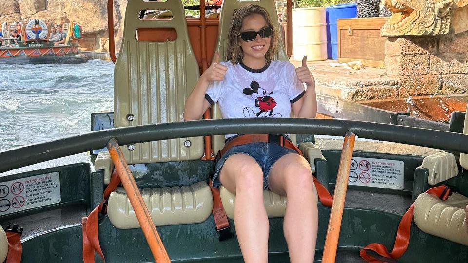 Sydney Sweeney poses on a water ride at Disneyland