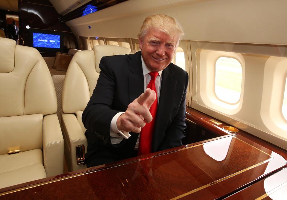 Trump onboard his Boeing 757 private jet.