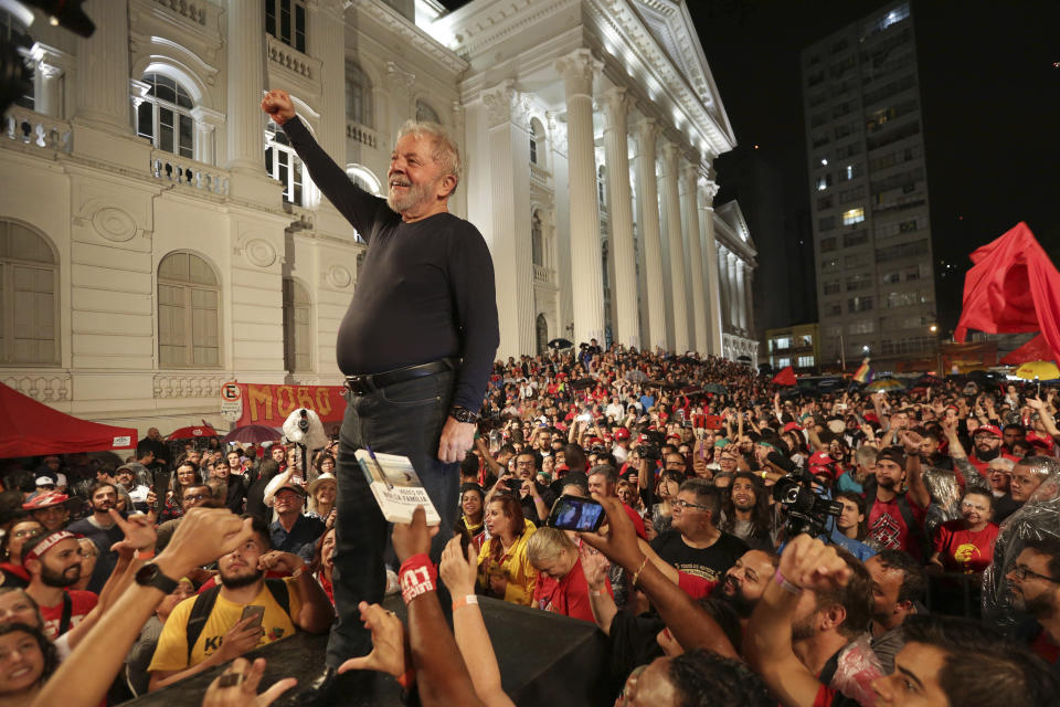 FILE - Brazil's former President Luiz Inacio Lula da Silva stands amid supporters during the final rally of his week-long campaign tour of southern Brazil, in Curitiba, Parana state, Brazil, March 28, 2018. (AP Photo/Eraldo Peres, File)