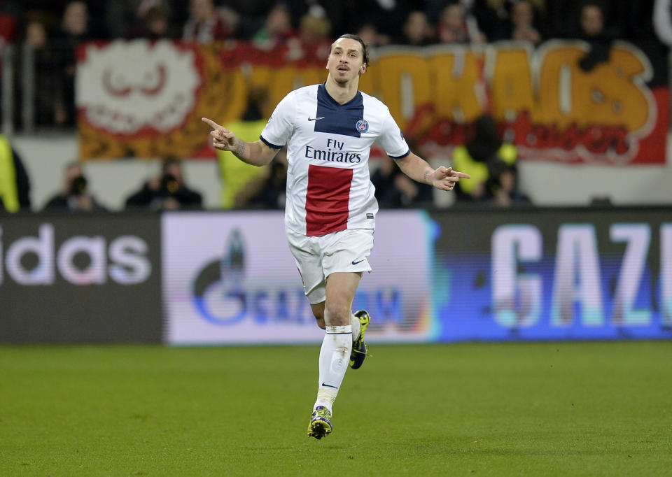 PSG's Zlatan Ibrahimovic celebrates his side's third goal during a Champions League round of the last 16 first leg soccer match between Bayer Leverkusen and Paris Saint-Germain in Leverkusen, Germany, Tuesday Feb. 18, 2014. (AP Photo/Martin Meissner)