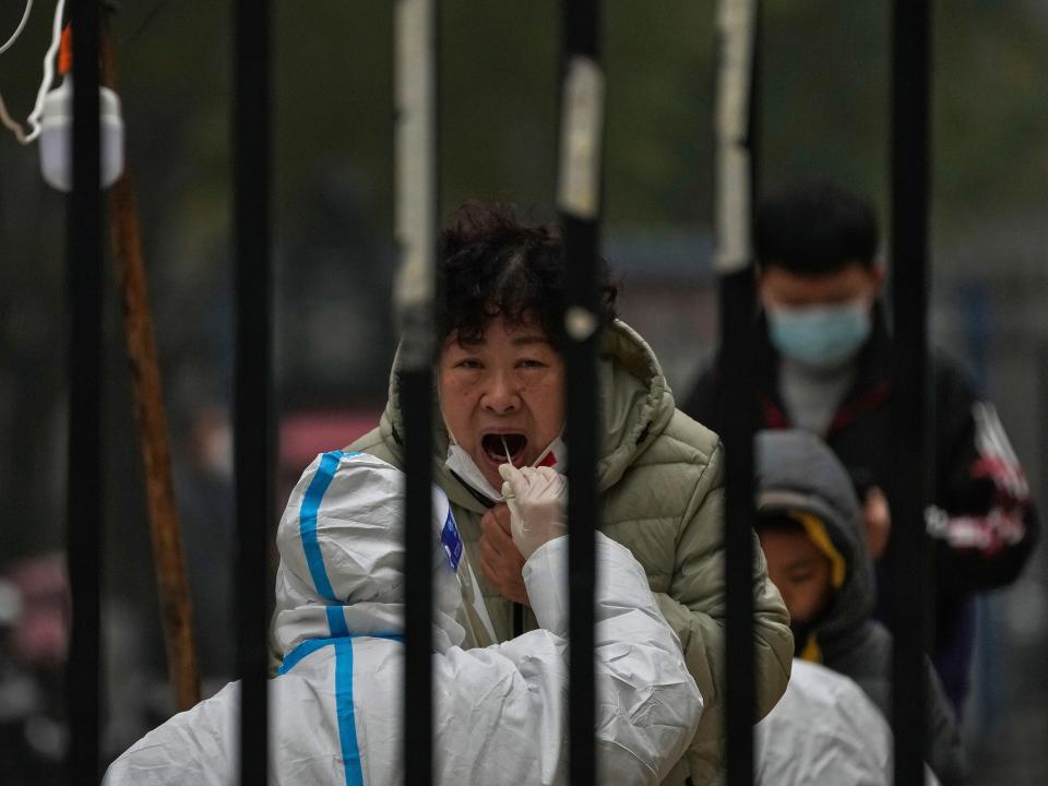 A woman receiving a COVID-19 test in China.