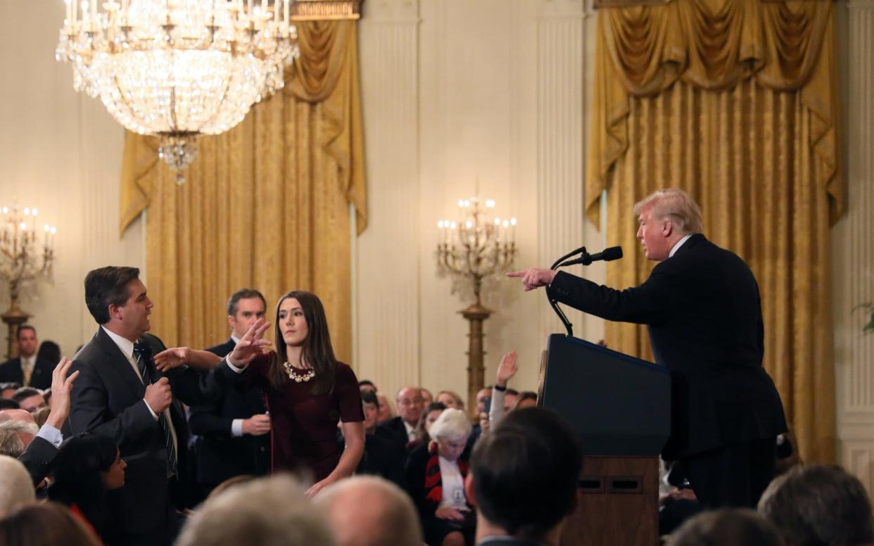 CNN's Jim Acosta questions Donald Trump during a news conference in Washington - REUTERS