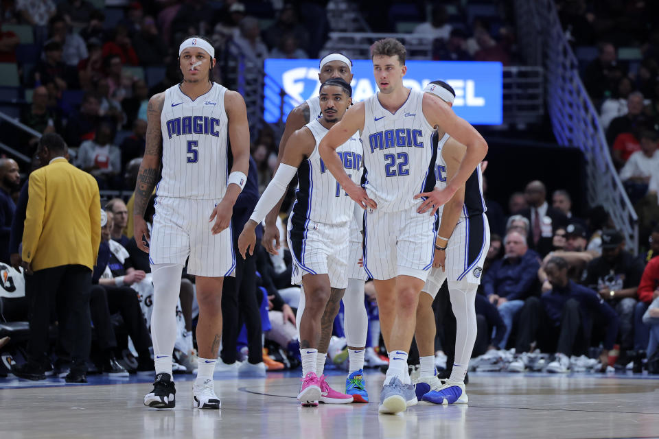 NEW ORLEANS, LOUISIANA - APRIL 03: Paolo Banchero #5, Franz Wagner #22 and Gary Harris #14 of the Orlando Magic react during a game against the New Orleans Pelicans at the Smoothie King Center on April 03, 2024 in New Orleans, Louisiana. NOTE TO USER: User expressly acknowledges and agrees that, by downloading and or using this Photograph, user is consenting to the terms and conditions of the Getty Images License Agreement. (Photo by Jonathan Bachman/Getty Images)