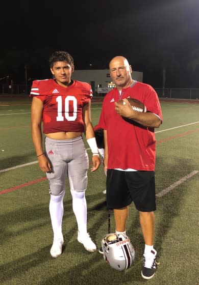 Quarterback AJ Duffy (left) plays for his father, Pete, head coach at Rancho Verde.