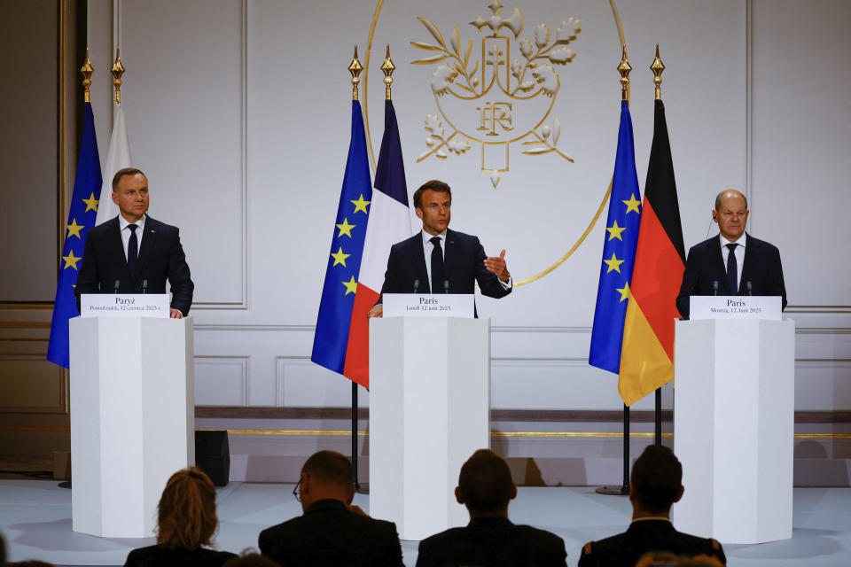 Polish President Andrzej Duda, left, French President Emmanuel Macron, center, and German Chancellor Olaf Scholz attend a joint press conference Monday, June 12, 2023 at the Elysee palace in Paris. Emmanuel Macron, German Chancellor Olaf Scholz and Polish President Andrzej Duda meet in Paris for talks focusing on military support for Ukraine's counteroffensive and future security guarantees to be given to the country, ahead of a NATO summit in July. (Sarah Meyssonnier, Pool via AP)