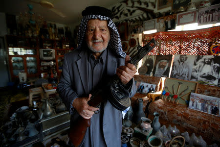 Youssef Akkar, 80, an Iraqi retired teacher poses for a picture in his museum at home in Najaf, Iraq February 21, 2019. REUTERS/Alaa al-Marjani