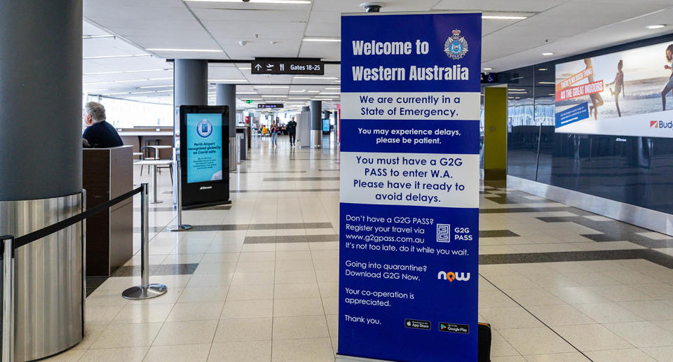 A photo from Perth airport showing a sign listing restrictions to enter WA.