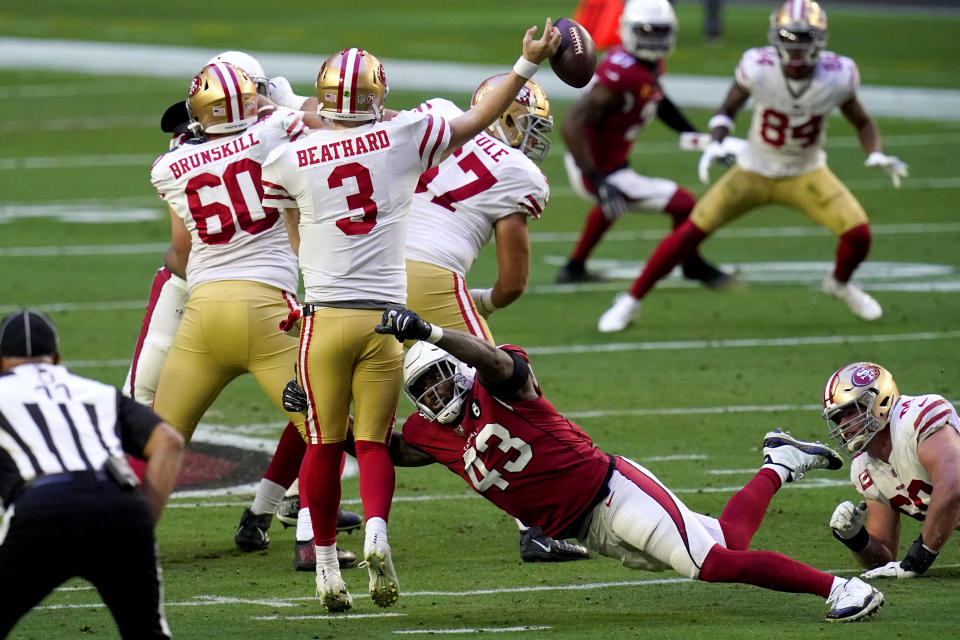 Arizona Cardinals outside linebacker Haason Reddick (43) forces San Francisco 49ers quarterback C.J. Beathard (3) to fumble the ball during the first half of an NFL football game, Saturday, Dec. 26, 2020, in Glendale, Ariz. The Cardinals recovered the ball. (AP Photo/Ross D. Franklin)