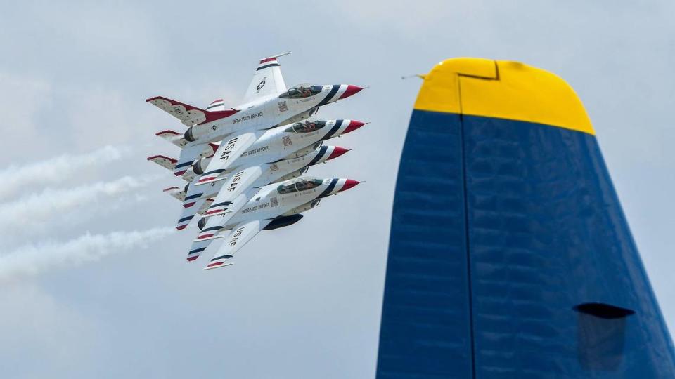 The United States Air Force Thunderbirds flew in a tight formation as they passed the Blue Angels support C-130 plane on the second and final day of the 2021 Kansas City Airshow at the New Century AirCenter in New Century, Kansas, July 4, 2021. This year, the Thunderbirds and the Blue Angels performed at the same show, which is rare.