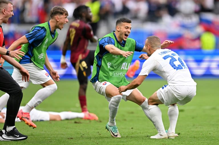 Slovakia players celebrate after beating <a class="link " href="https://sports.yahoo.com/soccer/teams/belgium/" data-i13n="sec:content-canvas;subsec:anchor_text;elm:context_link" data-ylk="slk:Belgium;sec:content-canvas;subsec:anchor_text;elm:context_link;itc:0">Belgium</a> in Frankfurt (Kirill KUDRYAVTSEV)