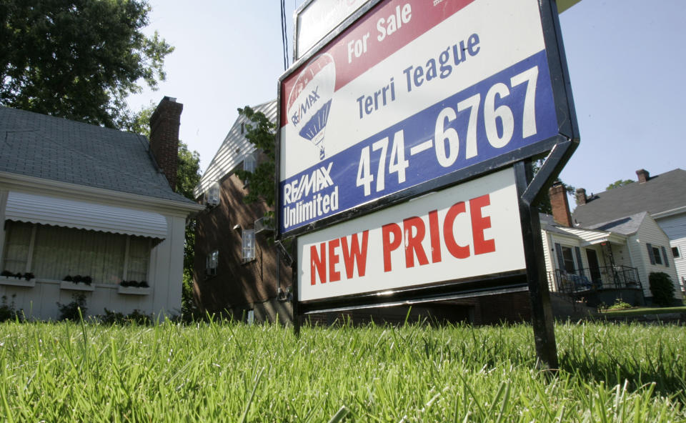 A home for sale shows the owner has lowered the asking price, Tuesday, July 31, 2007, in Cincinnati. With the housing and mortgage industries plunging deeper into distress, investors around the world are losing their stomach for risk. This means it will cost more to borrow, which could harm the stock market, home prices, and the broader economy. (AP Photo/Al Behrman)