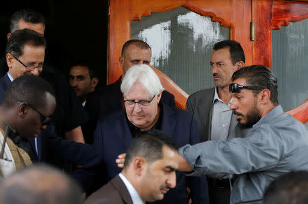 U.N. envoy to Yemen Martin Griffiths (C) is escorted by bodyguards as he arrives at Sanaa airport in Sanaa, Yemen June 16, 2018. REUTERS/Khaled Abdullah