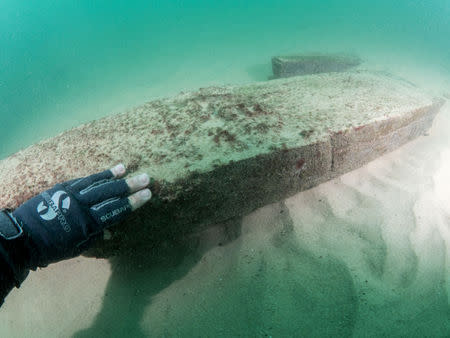 Divers are seen during the discovery of a centuries-old shipwreck, in Cascais in this handout photo released September 24, 2018. Augusto Salgado/Cascais City Hall/Handout via Reuters