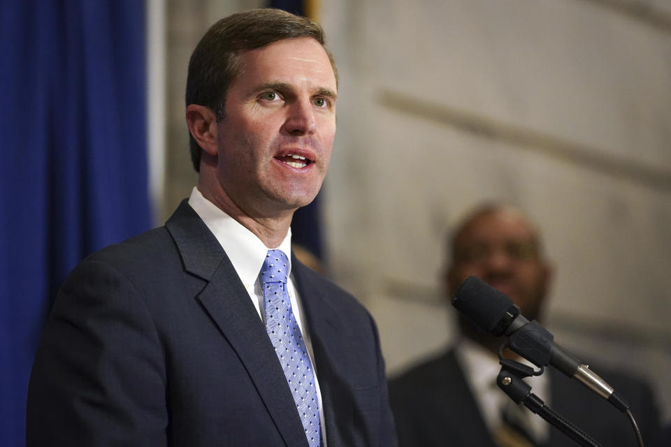 Kentucky Democratic Governor Andy Beshear speaks at a press conference before signing an executive order to reinstate the voting rights of over 100,000 non-violent felons who have completed their sentences, at the Capitol in Frankfort, Ky., Thursday, Dec. 12, 2019. (AP Photo/Bryan Woolston)