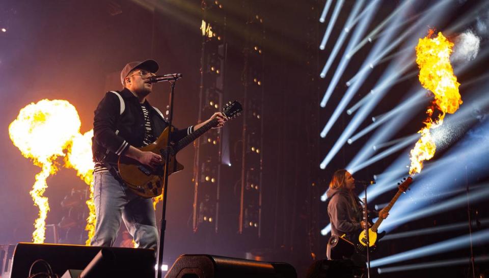 Fall Out Boy guitarist and vocalist Patrick Stump sings as flames arc from Pete Wentz’s bass during the group’s concert on Sunday at Golden 1 Center.